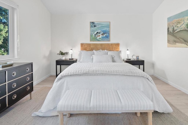 bedroom with light hardwood / wood-style floors