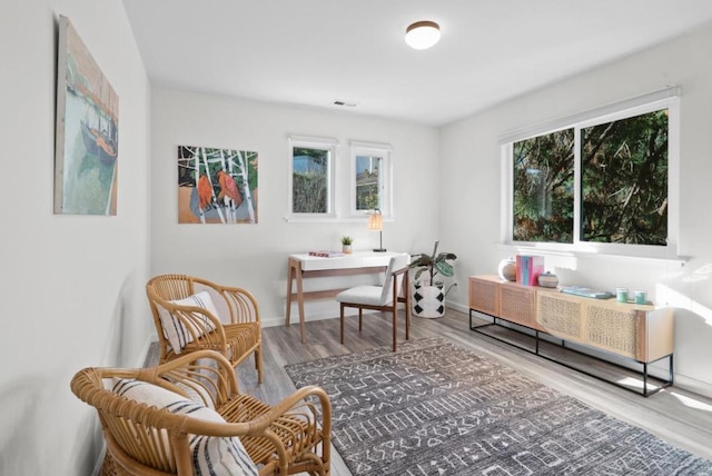 living area with hardwood / wood-style floors