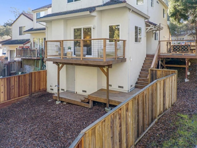 rear view of house featuring a deck