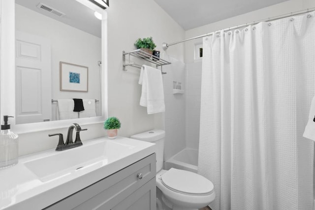 full bathroom with vanity, toilet, and shower / tub combo with curtain