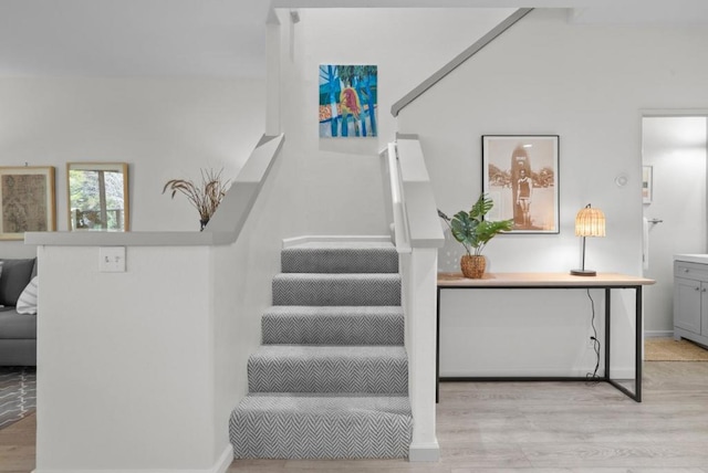 stairway with hardwood / wood-style floors