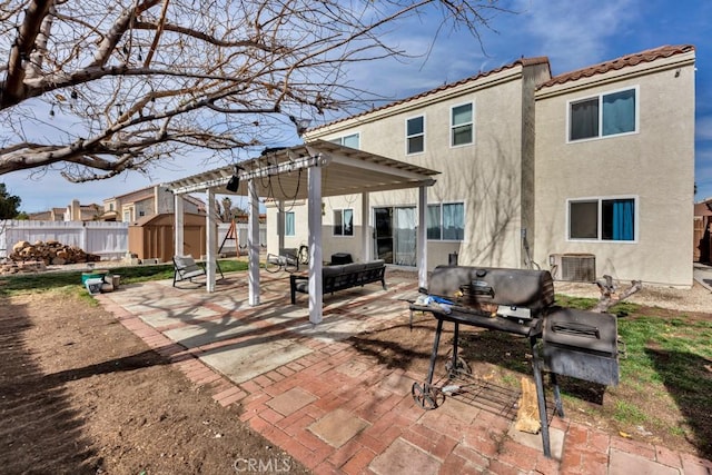 view of patio featuring a pergola, a shed, cooling unit, and grilling area