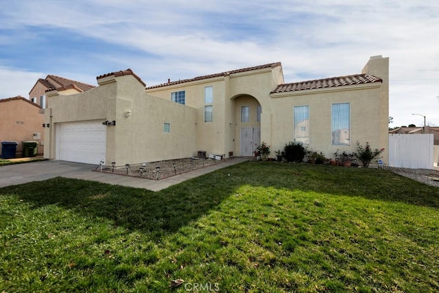 mediterranean / spanish house featuring a front yard