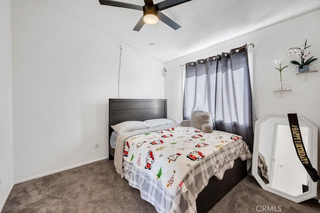 bedroom featuring ceiling fan and dark carpet