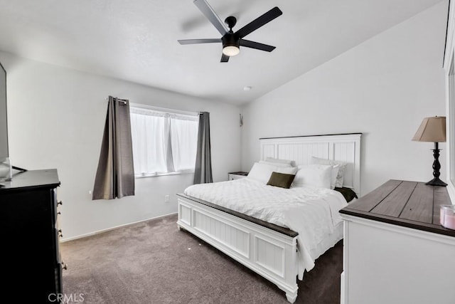 carpeted bedroom with ceiling fan and vaulted ceiling