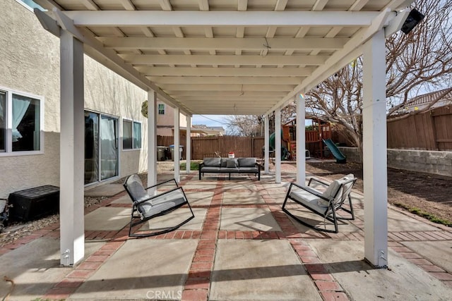 view of patio featuring a playground and outdoor lounge area