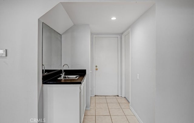 kitchen featuring sink and light tile patterned floors