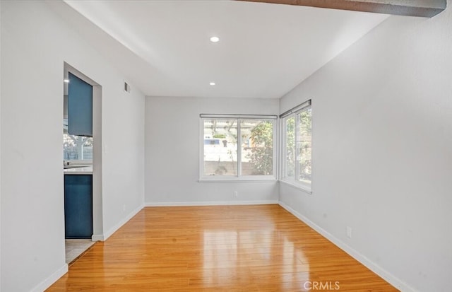 unfurnished room with light hardwood / wood-style flooring