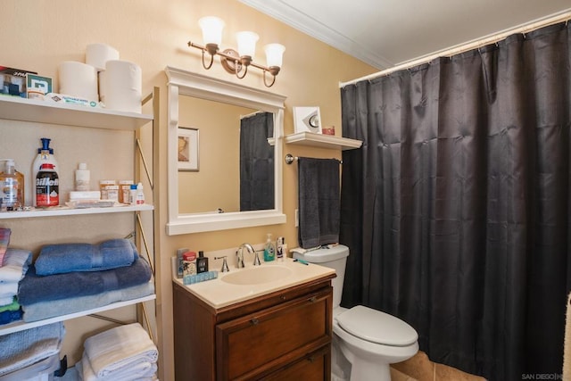 bathroom with vanity, toilet, and ornamental molding