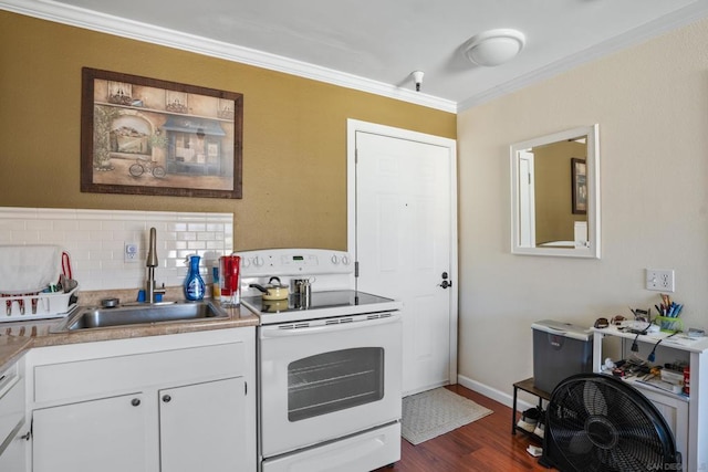 kitchen with white appliances, white cabinetry, dark wood-type flooring, and sink