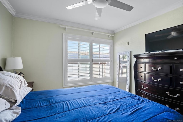 bedroom featuring ceiling fan and crown molding