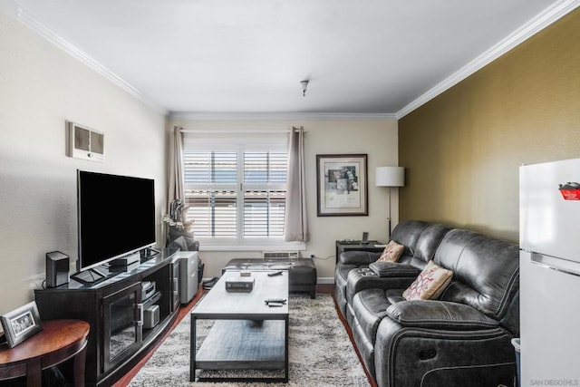 living room with hardwood / wood-style floors and crown molding