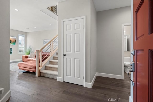 foyer entrance featuring dark wood-type flooring