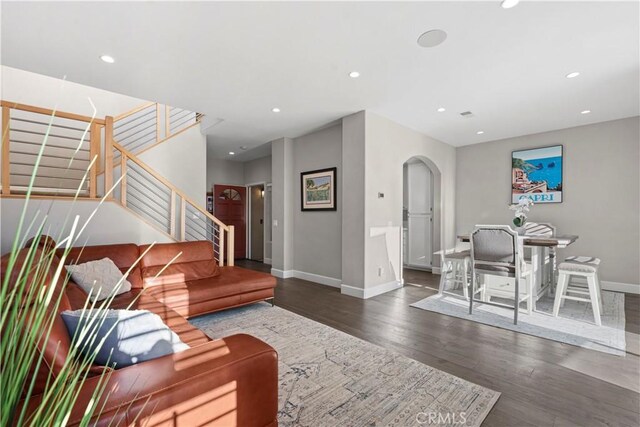 living room with dark wood-type flooring