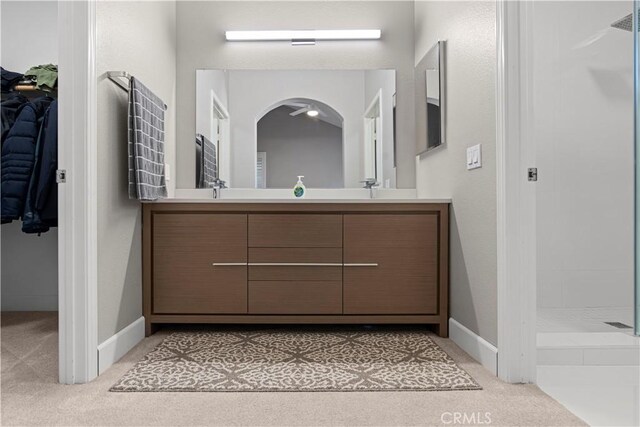 bathroom with vanity and walk in shower