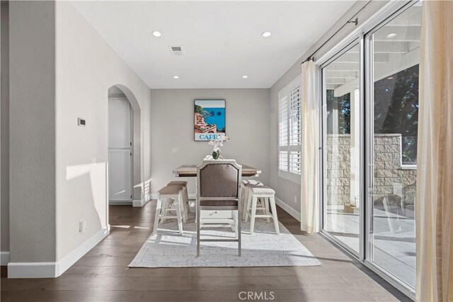 dining area with dark wood-type flooring