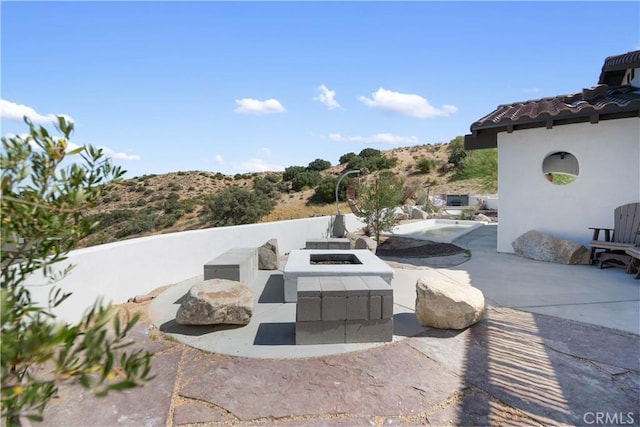 view of patio / terrace with a fire pit