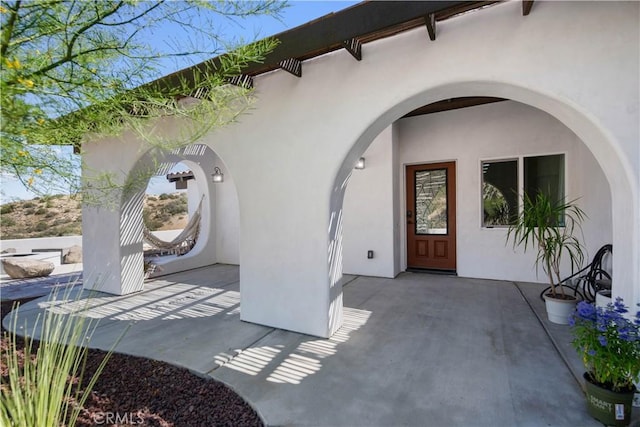 doorway to property with a patio