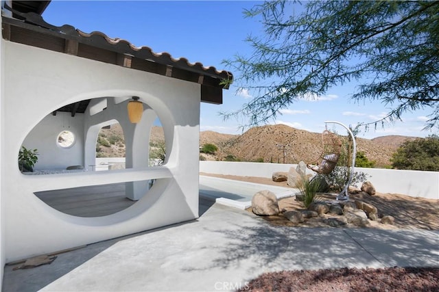 view of patio with a mountain view