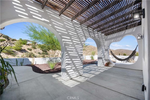 view of patio / terrace with a mountain view