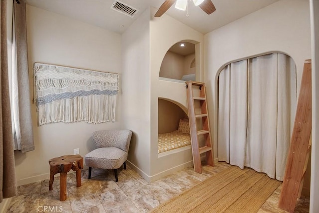 sitting room with ceiling fan