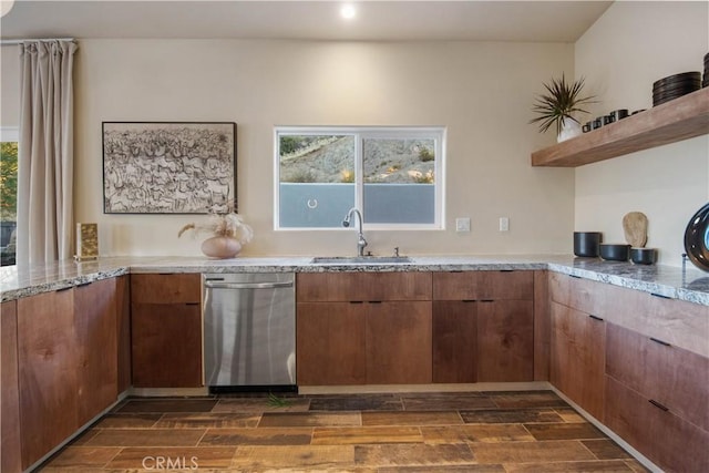 kitchen featuring stainless steel dishwasher and sink