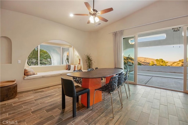 dining area with ceiling fan and lofted ceiling