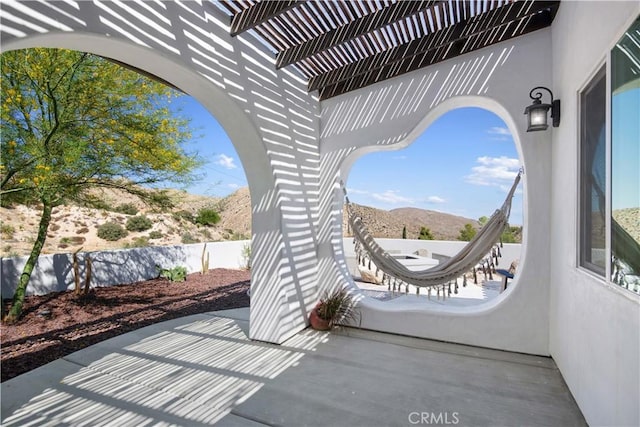 view of patio featuring a mountain view and a pergola