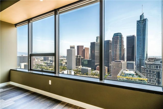 unfurnished room featuring hardwood / wood-style floors