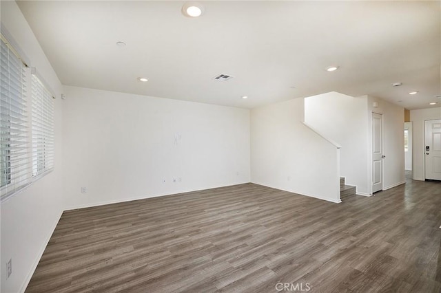 empty room with dark wood-type flooring