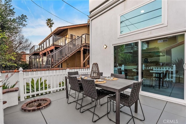 view of patio / terrace with a fire pit