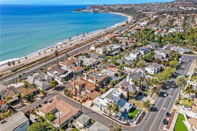 birds eye view of property featuring a water view and a view of the beach