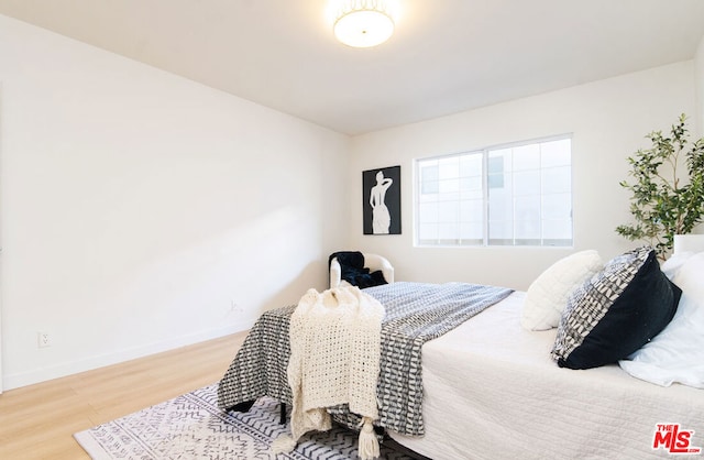 bedroom featuring hardwood / wood-style floors