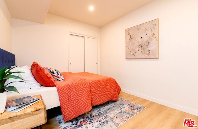 bedroom with hardwood / wood-style flooring