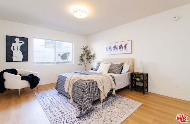 bedroom with hardwood / wood-style floors