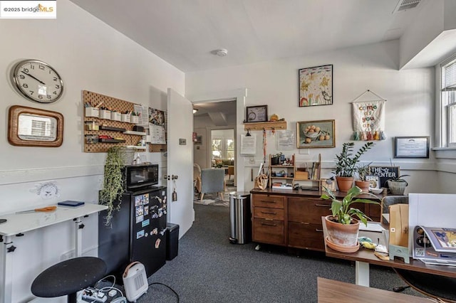 home office featuring dark carpet