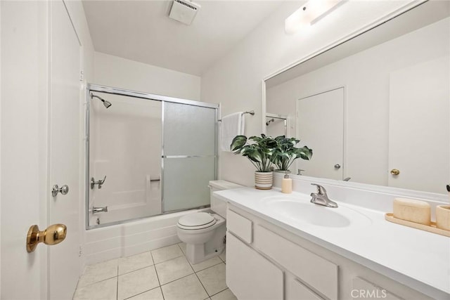 full bathroom with toilet, bath / shower combo with glass door, tile patterned flooring, and vanity