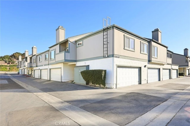 view of side of property featuring a garage