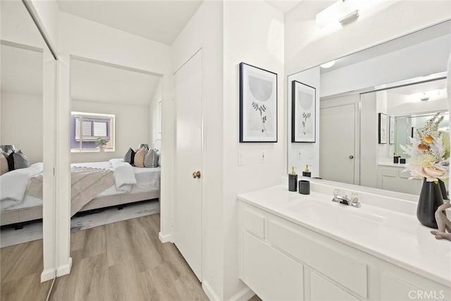 bathroom with vanity and hardwood / wood-style floors