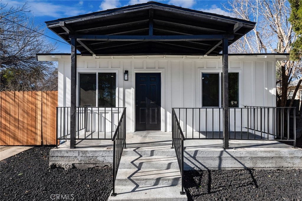 property entrance with covered porch