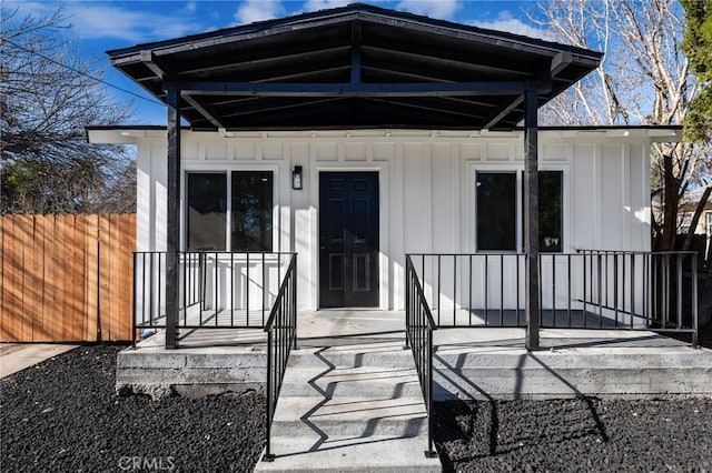 property entrance with covered porch