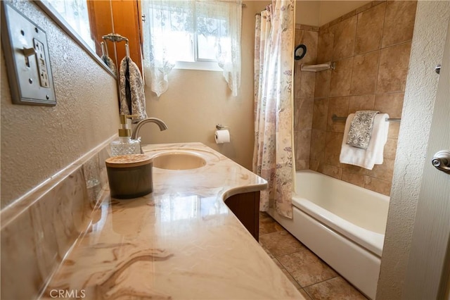 bathroom featuring tile patterned flooring, shower / bath combo, and vanity