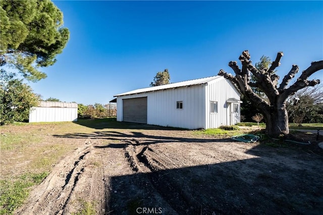 view of outbuilding with a garage