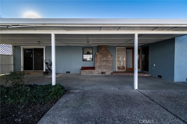 exterior space featuring a carport