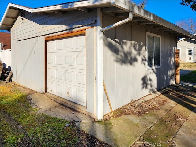 view of side of property with a garage