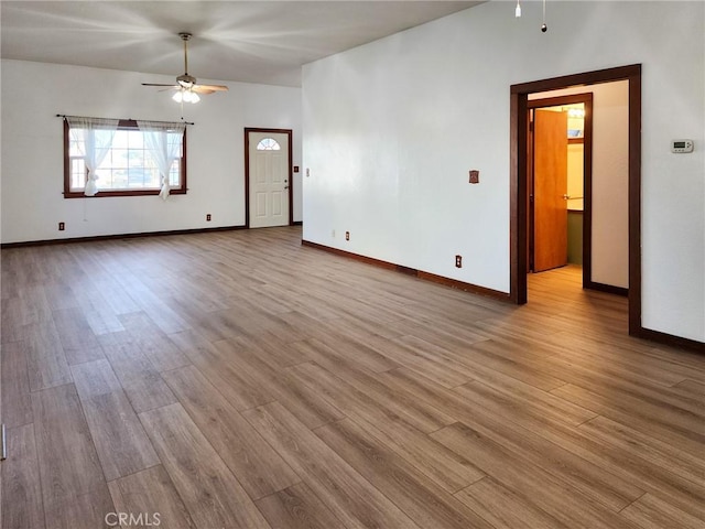 unfurnished room featuring ceiling fan and light hardwood / wood-style floors