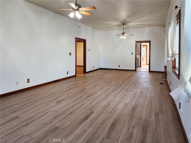 unfurnished living room featuring light hardwood / wood-style floors and ceiling fan