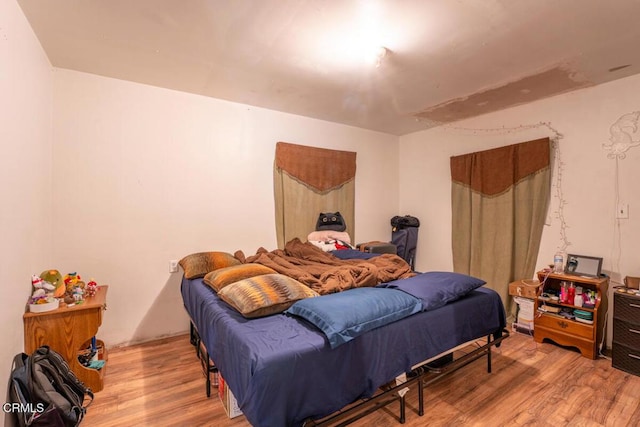 bedroom with light wood-type flooring