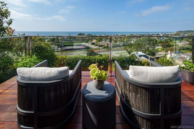 balcony featuring a water view