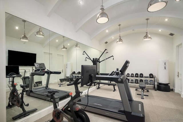 exercise area featuring lofted ceiling and brick ceiling